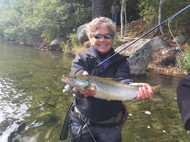 Fly fisher with a landlocked salmon