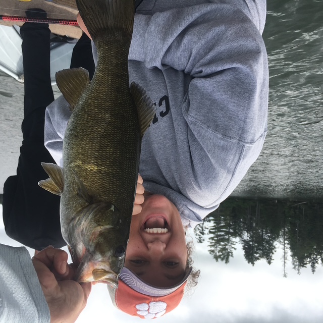 Angler with a smallmouth bass